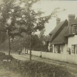 Ugley view with thatchedhouse and some residents